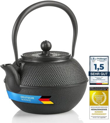 Asian cast iron teapot. Traditional iron teapot.