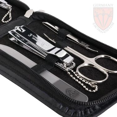 Набір для догляду за нігтями Drei Schwertter 'Novara' - 8 предметів: ножиці, пилка, щипці, пінцет, кусачки та інше. З чорної шкірозамінника.