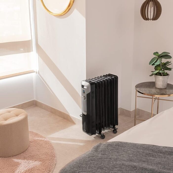 Електричний масляний радіатор Cecotec ReadyWarm 11000 Space - 2500 Вт, 11 ребер обігріву, 3 режими, 25 м², з кабелеутримувачем, ручкою та колесами (білий/чорний, 2000 Вт)