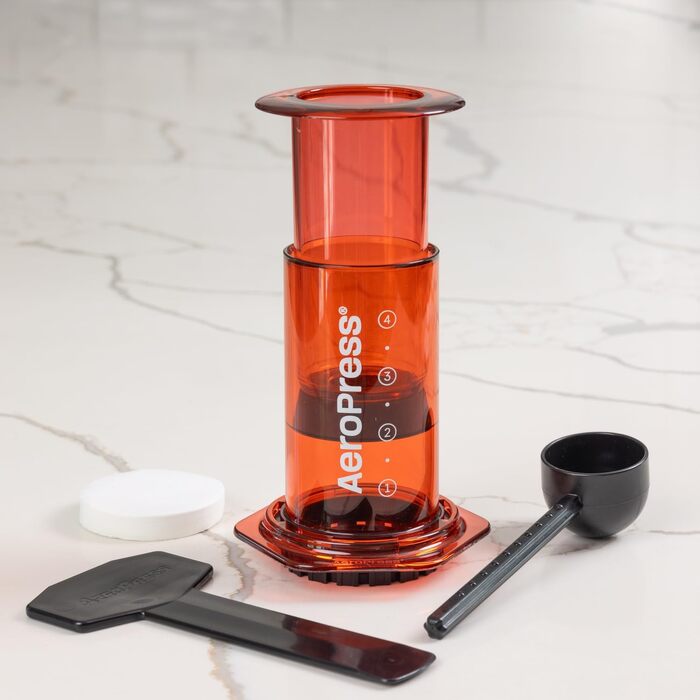 AeroPress Clear Coffee Press – 3-in-1 Coffee Machine combines French Press, Pour Over & Espresso – Full-bodied coffee without bitterness – Portable mini coffee machine for travel, Transparent (Standard, Red)