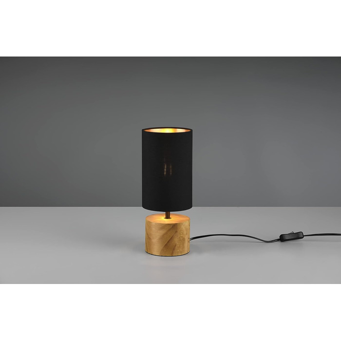 Настільна лампа Reality Leuchten Woody R50181080: чорний матовий метал, дерев'яний цоколь, абажур з тканини золотого кольору, без лампочки E27. Діаметр абажура 12 см