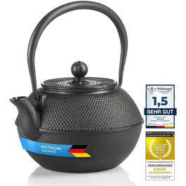 Asian cast iron teapot. Traditional iron teapot.