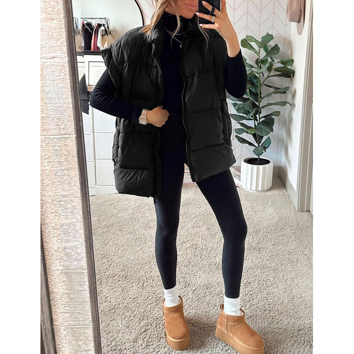 Жіноча зимова укорочена пухова жилетка. Легка, тепла, без рукавів, зі стійким коміром, з кишенями. Чорна