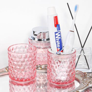 Pink bathroom accessory set made of glass, including a toothbrush holder, soap dispenser, and cup, a foaming soap dispenser, and a toothbrush holder, 3 pink bathroom cups for brush, toothpaste.