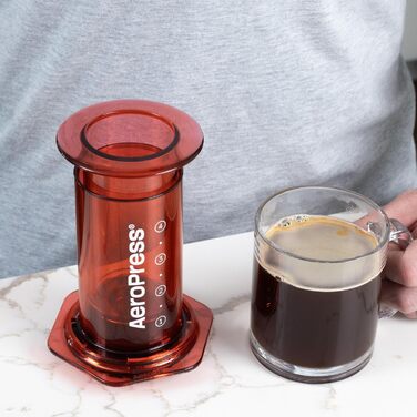 AeroPress Clear Coffee Press – 3-in-1 Coffee Machine combines French Press, Pour Over & Espresso – Full-bodied coffee without bitterness – Portable mini coffee machine for travel, Transparent (Standard, Red)
