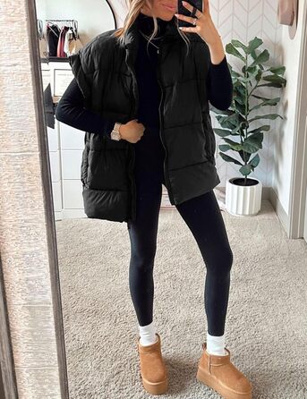 Жіноча зимова укорочена пухова жилетка. Легка, тепла, без рукавів, зі стійким коміром, з кишенями. Чорна